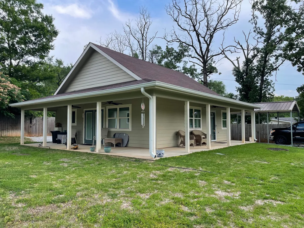 Single-story home with a wide covered porch across the front